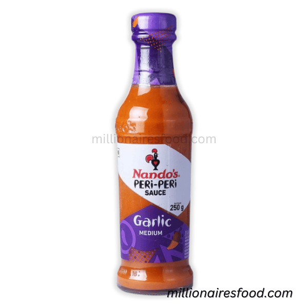 nandos-peri-peri-sauce-garlic-medium 250 gm Nando’s Peri-Peri Sauce Garlic Medium 250gm (UAE) – Zesty & Flavorful - Image 1